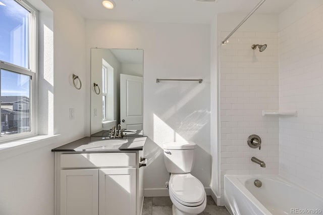 full bathroom with shower / bath combination, plenty of natural light, vanity, and toilet