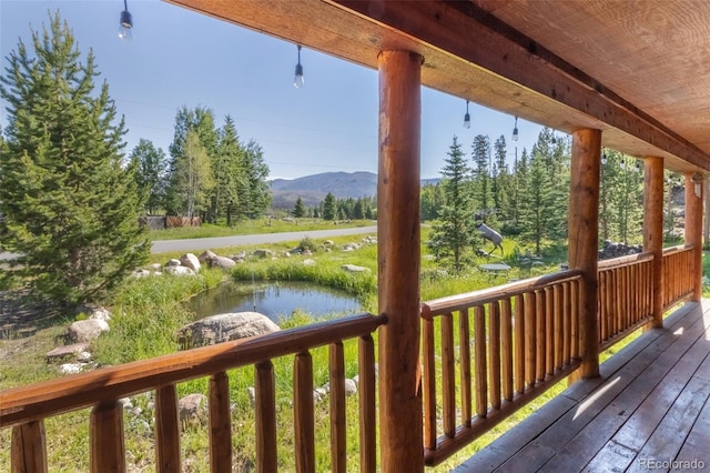 deck featuring a water and mountain view