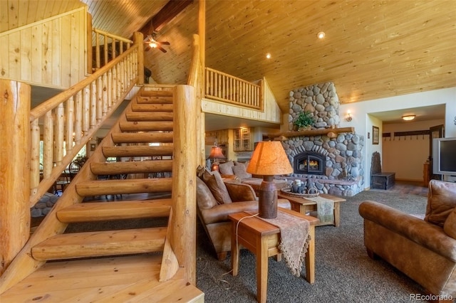 carpeted living room with ceiling fan, wood ceiling, a fireplace, and high vaulted ceiling