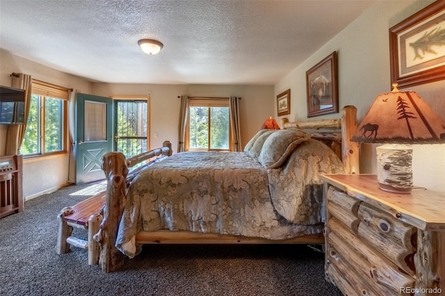 carpeted bedroom with a textured ceiling