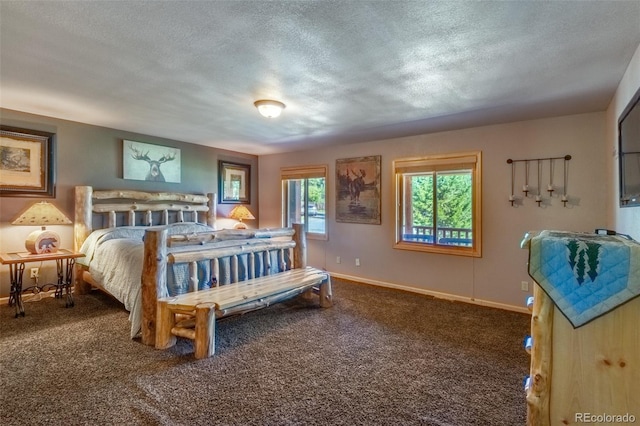 bedroom with carpet and a textured ceiling