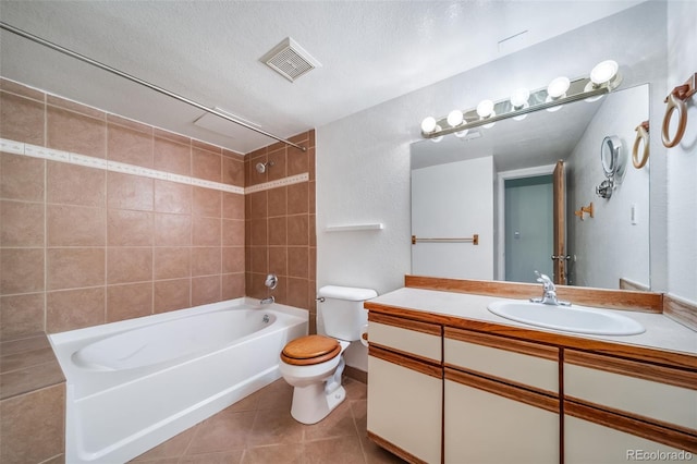 bathroom featuring toilet,  shower combination, visible vents, tile patterned flooring, and vanity