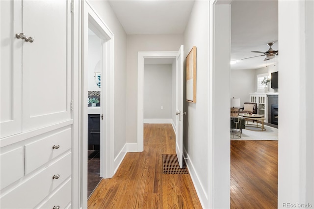 3743 N Yates St, Denver, CO 80212 - hallway featuring light wood finished floors and baseboards