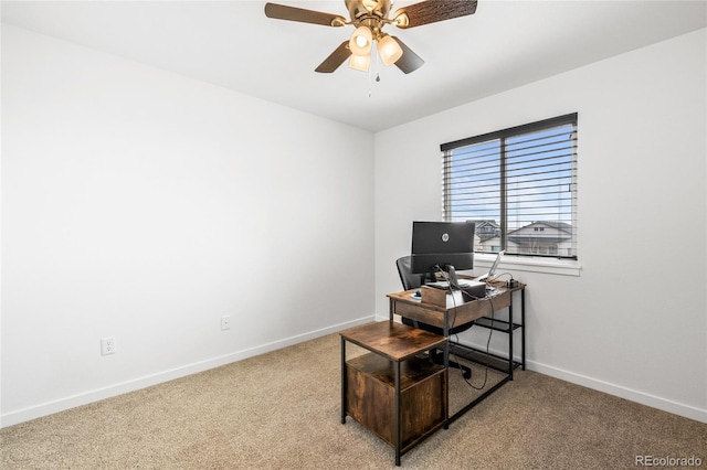 office area featuring ceiling fan, carpet flooring, and baseboards