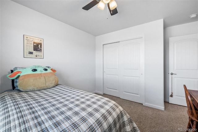 bedroom featuring carpet floors, a closet, a ceiling fan, and baseboards