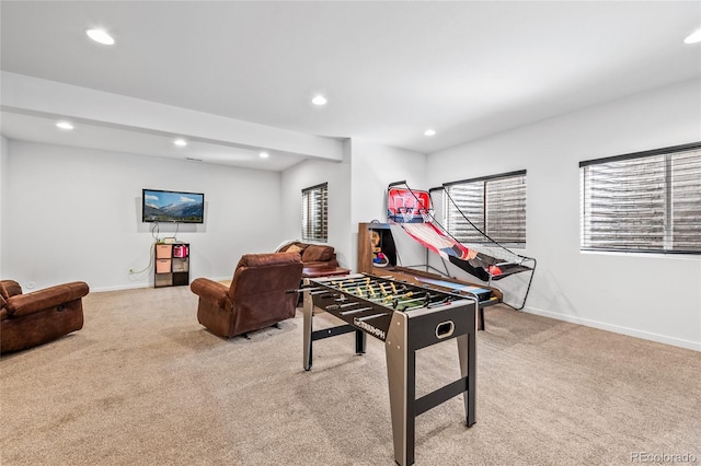 recreation room featuring recessed lighting, light carpet, and plenty of natural light