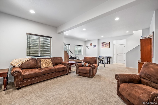 living room featuring light carpet, baseboards, and recessed lighting