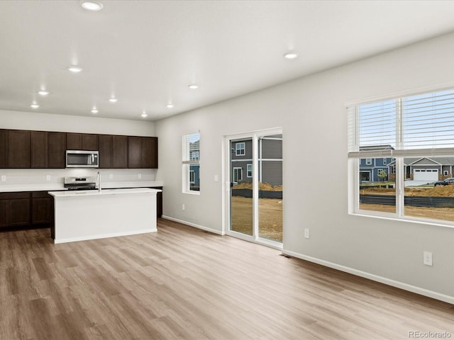2728 73rd Avenue Ct, Greeley, CO 80634 - kitchen with stainless steel appliances, plenty of natural light, light wood-style floors, and recessed lighting