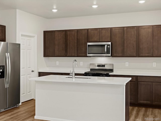 2728 73rd Avenue Ct, Greeley, CO 80634 - kitchen featuring appliances with stainless steel finishes, a sink, light wood-style flooring, light countertops, and recessed lighting