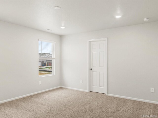 2728 73rd Avenue Ct, Greeley, CO 80634 - unfurnished room with carpet flooring, baseboards, a smoke detector, and recessed lighting