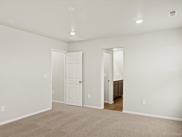 2728 73rd Avenue Ct, Greeley, CO 80634 - unfurnished bedroom featuring carpet, recessed lighting, baseboards, and ensuite bathroom