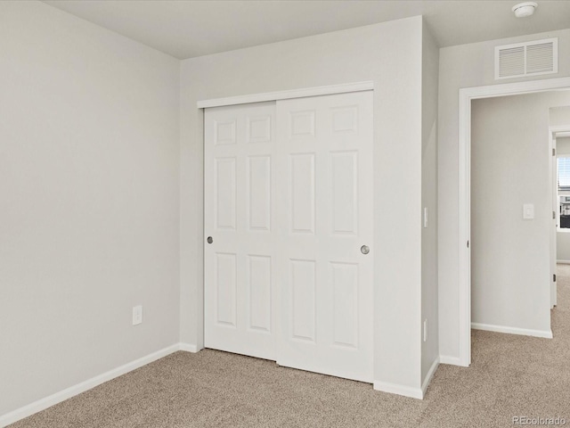 2728 73rd Avenue Ct, Greeley, CO 80634 - unfurnished bedroom with light carpet, baseboards, and a closet
