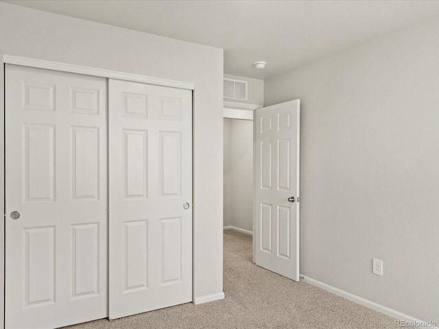 2728 73rd Avenue Ct, Greeley, CO 80634 - unfurnished bedroom featuring light carpet, a closet, and baseboards