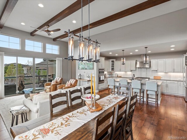 10553 Fairhurst Way, Highlands Ranch, CO 80126 - dining space featuring a ceiling fan, beam ceiling, recessed lighting, dark wood-style floors, and a chandelier