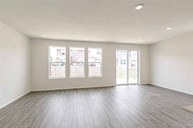 13322 E 110th Way, Commerce City, CO 80022 - unfurnished room featuring wood finished floors and recessed lighting