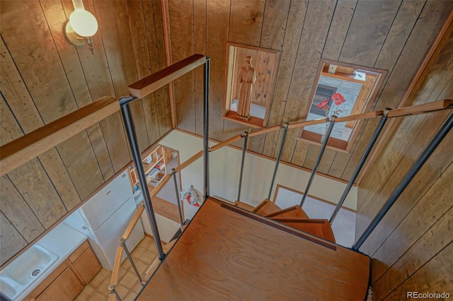 staircase with wooden walls