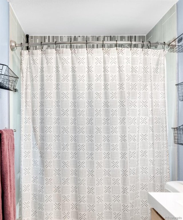 12175 Birch St, Thornton, CO 80241 - bathroom featuring a shower with curtain and vanity