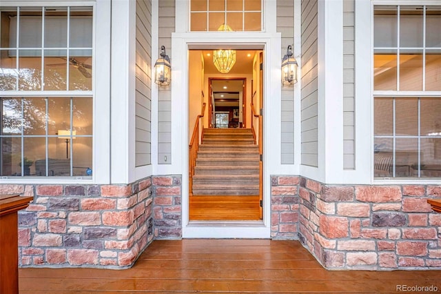 7506 Urban Ct, Arvada, CO 80005 - property entrance featuring a porch and stone siding