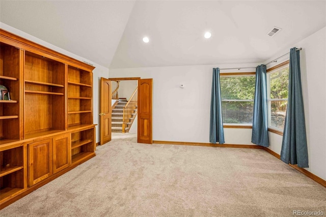 7506 Urban Ct, Arvada, CO 80005 - spare room featuring light colored carpet, vaulted ceiling, and recessed lighting