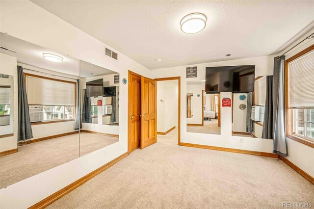7506 Urban Ct, Arvada, CO 80005 - spare room featuring carpet and a textured ceiling