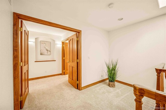 7506 Urban Ct, Arvada, CO 80005 - corridor with light colored carpet and baseboards