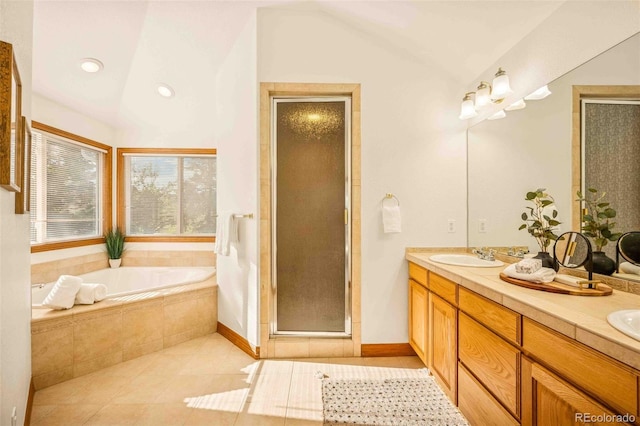 7506 Urban Ct, Arvada, CO 80005 - full bath with lofted ceiling, a garden tub, double vanity, tile patterned flooring, and a shower stall
