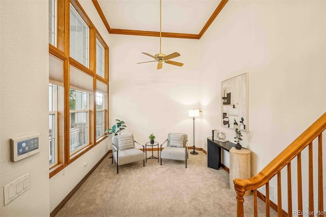 7506 Urban Ct, Arvada, CO 80005 - sitting room with crown molding, carpet flooring, a towering ceiling, and a ceiling fan