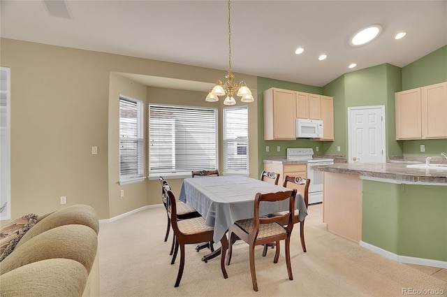 dining space with light carpet, baseboards, an inviting chandelier, vaulted ceiling, and recessed lighting