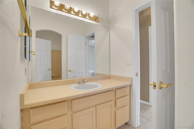 bathroom with vanity and tile patterned floors