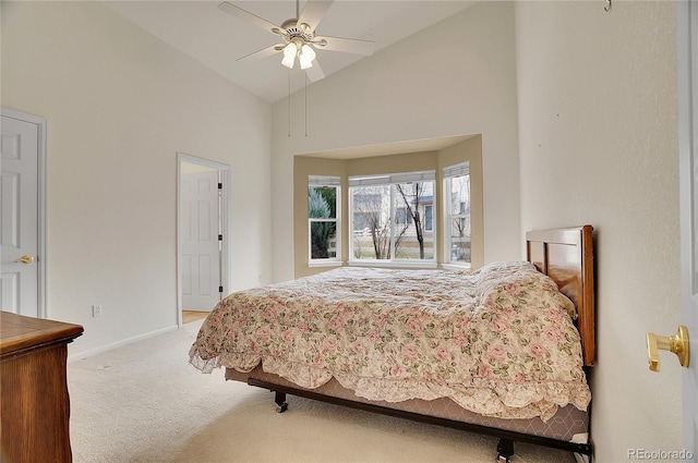 bedroom featuring high vaulted ceiling, carpet, baseboards, and a ceiling fan