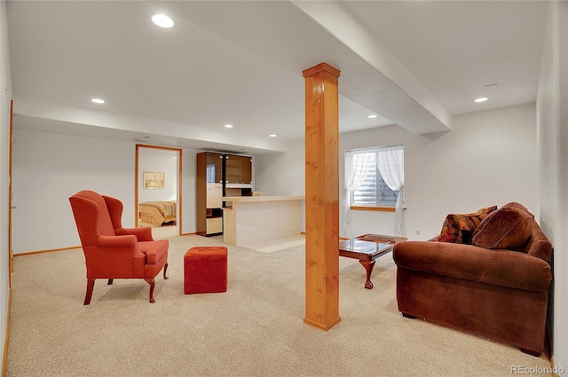 carpeted living area featuring baseboards and recessed lighting