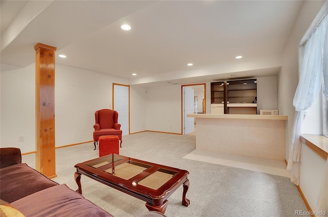 carpeted living room featuring baseboards and recessed lighting