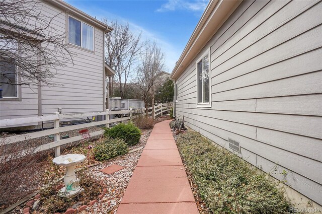 view of home's exterior featuring fence