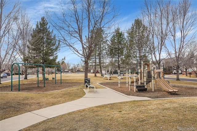 community jungle gym with a lawn