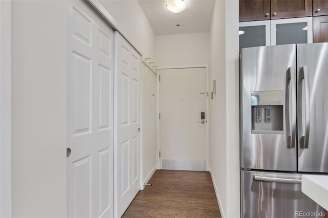 kitchen with stainless steel fridge with ice dispenser and dark hardwood / wood-style floors