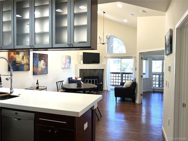 1000 E 1st Ave Unit 405, Denver, CO 80218 - kitchen with light countertops, dark wood-style floors, plenty of natural light, and dishwasher