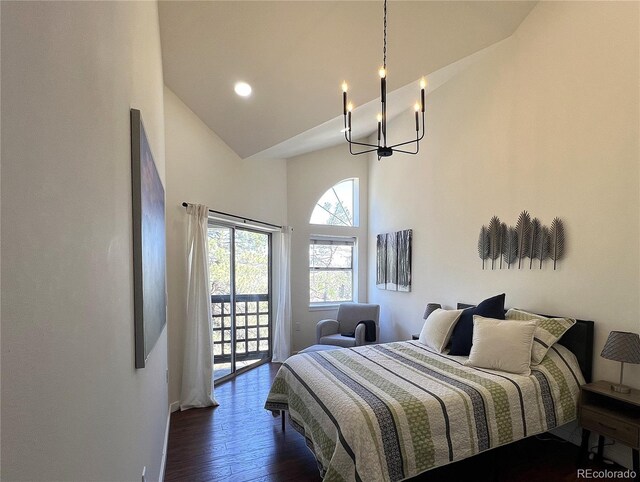 1000 E 1st Ave Unit 405, Denver, CO 80218 - bedroom with an inviting chandelier, baseboards, high vaulted ceiling, access to outside, and dark wood finished floors
