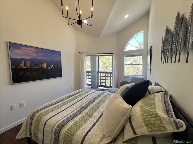 1000 E 1st Ave Unit 405, Denver, CO 80218 - bedroom featuring dark wood-style flooring, high vaulted ceiling, a chandelier, access to exterior, and baseboards