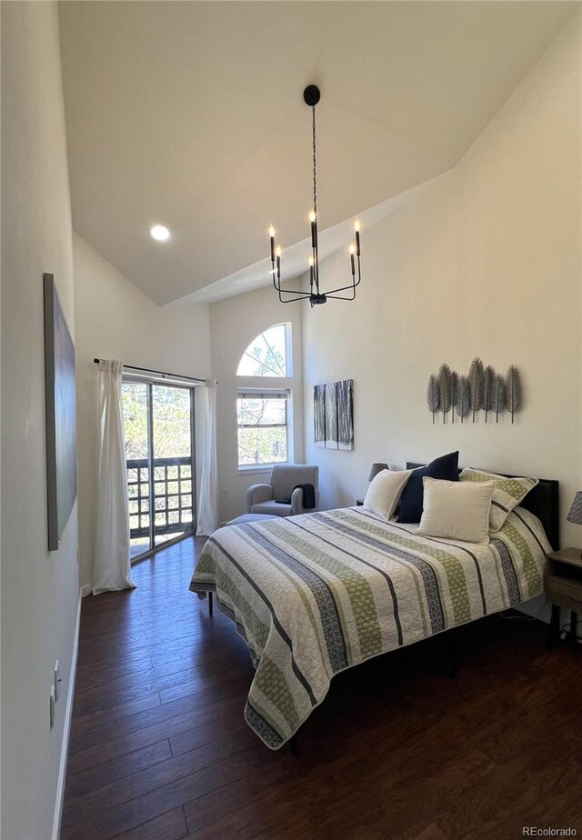 1000 E 1st Ave Unit 405, Denver, CO 80218 - bedroom with access to exterior, wood finished floors, baseboards, a notable chandelier, and recessed lighting