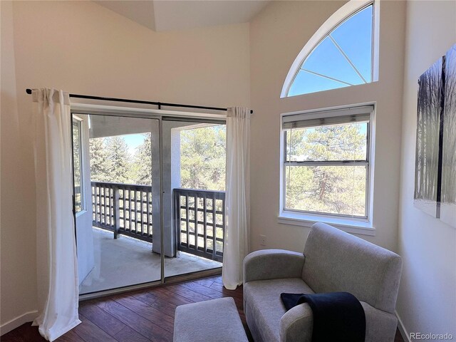 1000 E 1st Ave Unit 405, Denver, CO 80218 - doorway to outside with hardwood / wood-style floors and a towering ceiling