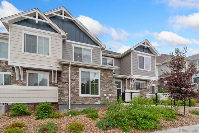 5745 S Buchanan Ct Unit C, Aurora, CO 80016 - craftsman-style home featuring board and batten siding and stone siding