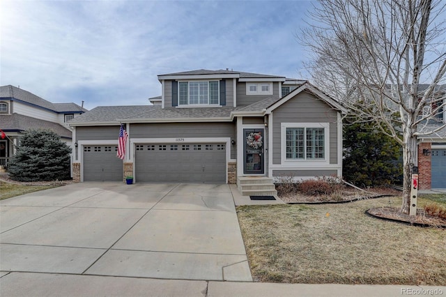 view of front of house featuring a garage and a front yard