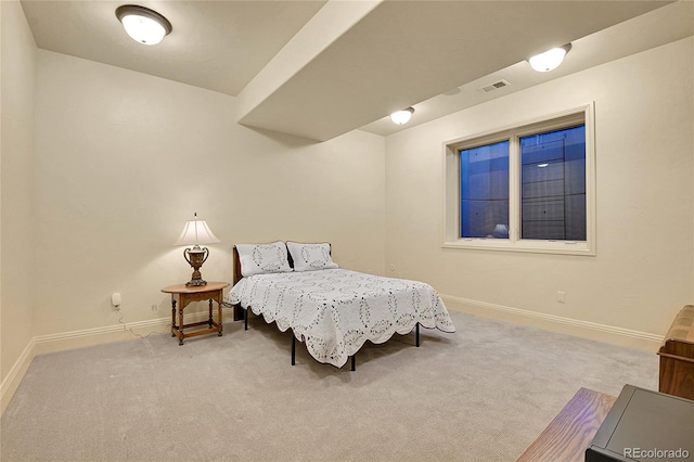 bedroom with light colored carpet