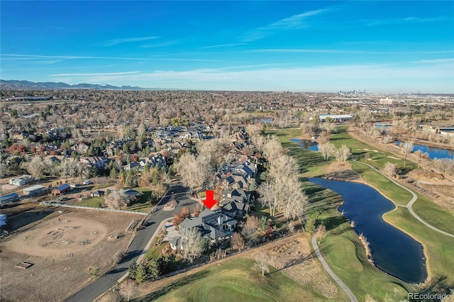 birds eye view of property with a water and mountain view