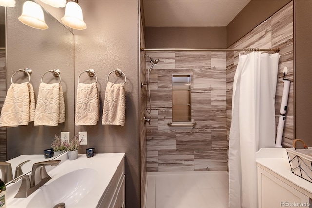 bathroom with vanity and a shower with shower curtain