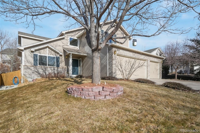 view of front of house featuring a front lawn, driveway, an attached garage, and fence