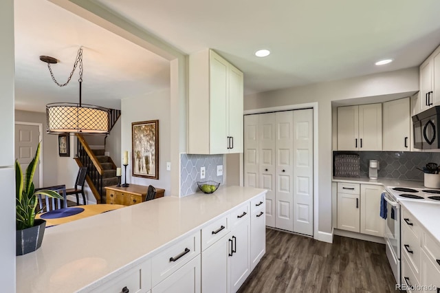 kitchen featuring black microwave, white electric range oven, light countertops, backsplash, and recessed lighting
