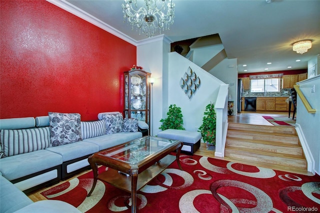 living room with recessed lighting, a notable chandelier, ornamental molding, stairway, and light wood-type flooring