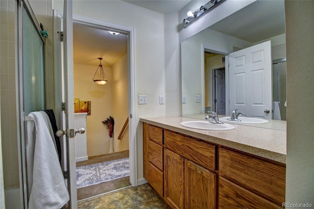 bathroom with an enclosed shower and vanity