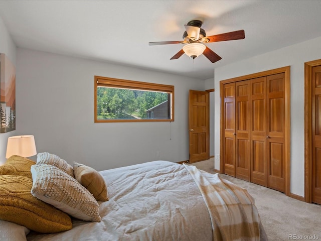 689 S Pine Dr, Bailey, CO 80421 - bedroom with light colored carpet, ceiling fan, and a closet